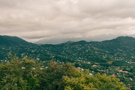 travel to Georgia - green trees and view of Batumi city with suburb from Sameba hill on autumn day. High quality photoの写真素材