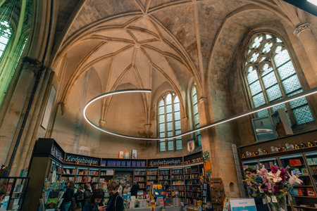 Maastricht, Netherlands - OCT 1 2025 Interior view of famous bookstore Book Store Dominicanen. High...