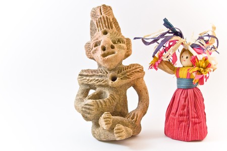 Mexican clay handricraft and husk doll handricraft.