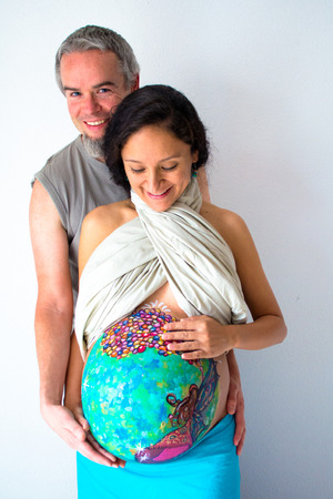 Colorful belly painting of a pregnant womanの写真素材
