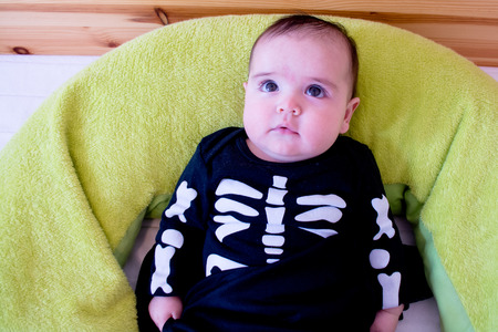 Baby under four months old dressed for Halloweenの写真素材