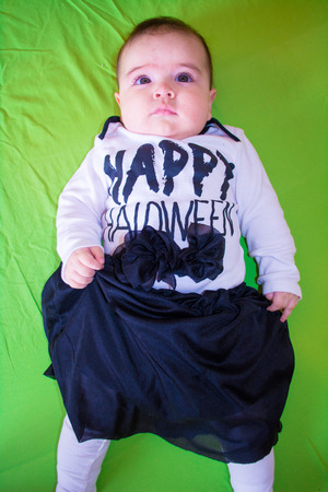 Baby under four months old dressed for Halloweenの写真素材