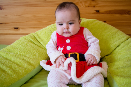 Baby under four months old dressed for Christmasの写真素材