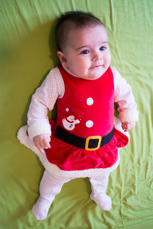 Baby under four months old dressed for Christmasの写真素材