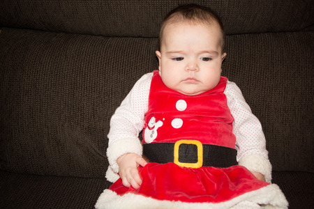 Baby under four months old dressed for Christmasの写真素材