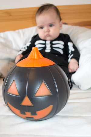 Baby under four months old dressed for Halloweenの写真素材