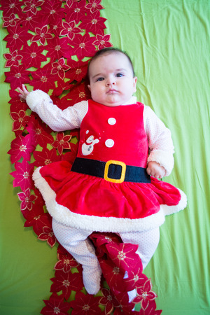 Baby under four months old dressed for Christmasの写真素材