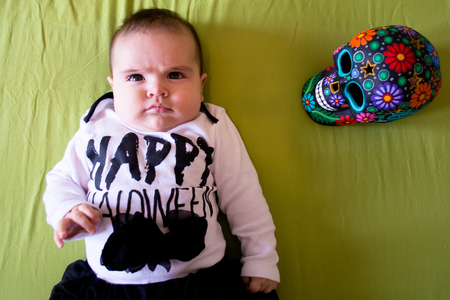 Baby under four months old dressed for Halloweenの写真素材