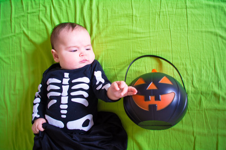 Baby under four months old dressed for Halloweenの写真素材