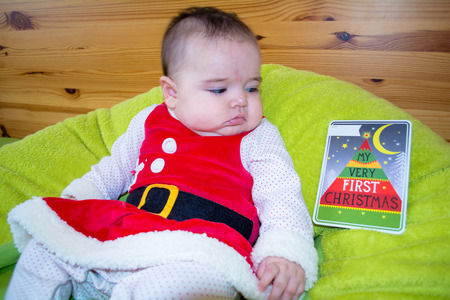 Baby under four months old dressed for Christmasの写真素材