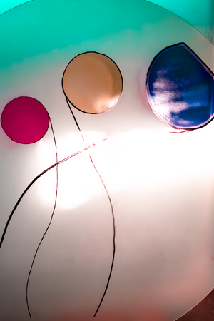 Colorful painted glass. Handmade work ideal for abstract backgrounds.の写真素材