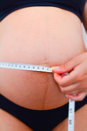 Pregnancy follow up. Belly measurements.の写真素材