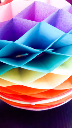 Paper decoration with rainbow colors, ideal for creative designsの写真素材