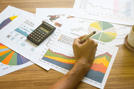 business man working with graphs and charts.