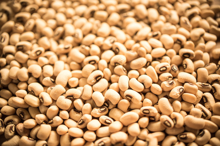 Soybeans on the old wooden tableの写真素材