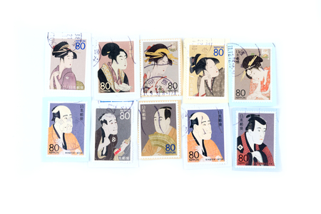 A postage stamp printed in Japan showing a painting of a Japanese people.のeditorial素材