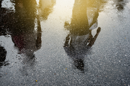 Puddle of water in rain - selective focusの写真素材