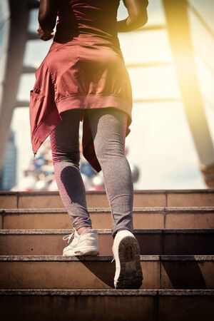 Close up on shoe athlete, Woman running in city. Sport Conceptの写真素材