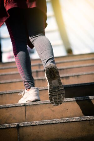 Close up on shoe athlete, Woman running in city. Sport Conceptの写真素材