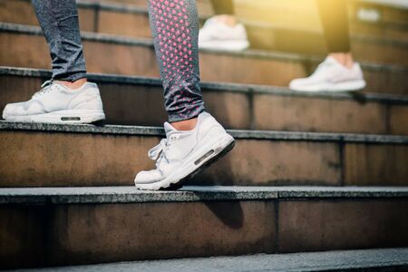 Close up on shoe athlete, Woman running in city. Sport Concept