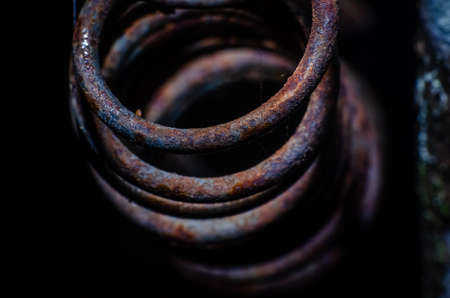 Old rusty metallic spring isolated background.の写真素材