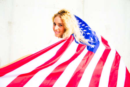 BLOND GIRL WITH USA FLAGの写真素材