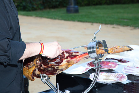 Cutting Spanish Iberian ham. Spanish ham and traditional food. Mediterranean diet.の写真素材