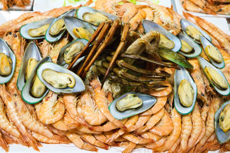Seafood. Set of different seafood, shrimp, prawns, mussels, spider crab, lobster to serve in a catering. Celebration and event conceptの写真素材