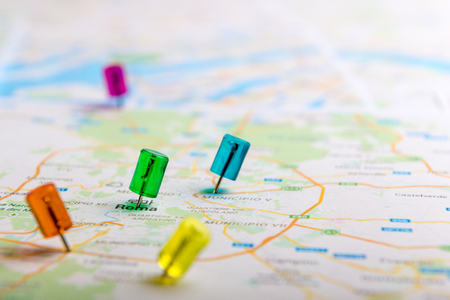 Blue pin marking location on mapの写真素材