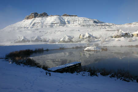 Snow covered lakeside holiday homesの写真素材