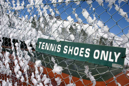 sign covered by snow Tennis shoes onlyの写真素材