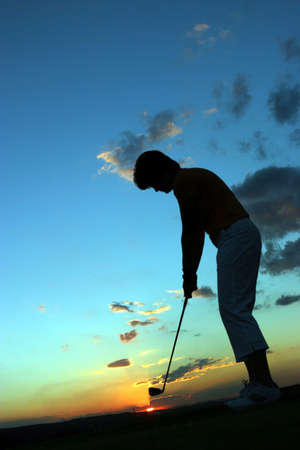 Silhouette of lady golferの写真素材