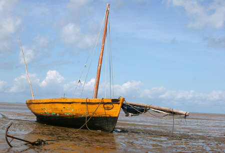 A boat stranded on the beach during low-tide in Bazaruto