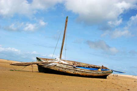 A boat stranded on the beach during low-tide in Bazaruto