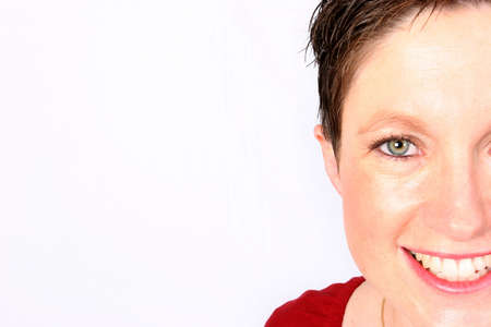 Woman giving you half a smileの写真素材