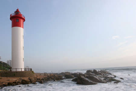 Lighthouse guarding the coastlineの写真素材