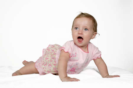 A little baby girl in her pink dress