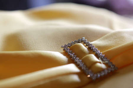 A diamond buckle on a yellow dressの写真素材