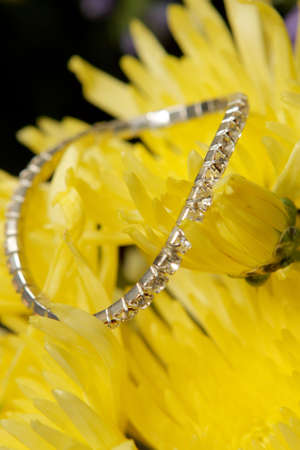 A diamond bracelet on yellow flowers