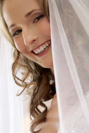 A bride with a veil on her headの写真素材