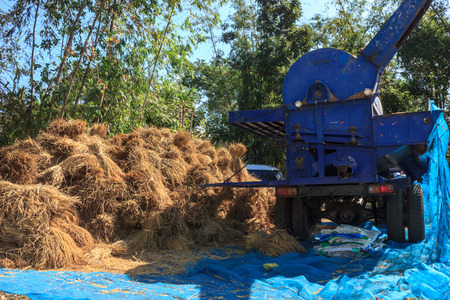 straw and the milling machine prepare for workingの写真素材