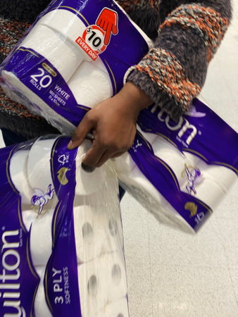 Lady panic buying toilet paper during the corona virus outbreak pandemic