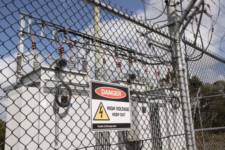High voltage electicity substation surounded by fence