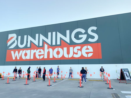 Customers queueing at Bunnings warehouse and social distancing during the 2020 corona COVID-19 Pandemicのeditorial素材