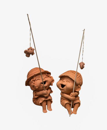 smile and happy baked  fishing doll isolatedの写真素材