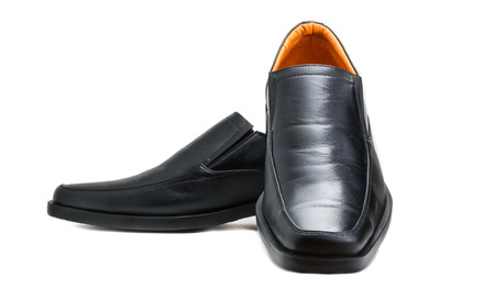 Black glossy man shoe isolated on white backgroundの写真素材