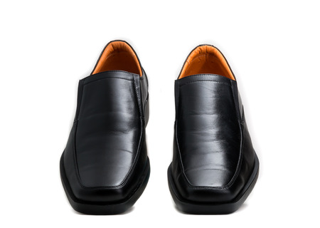 Black glossy man shoe isolated on white backgroundの写真素材