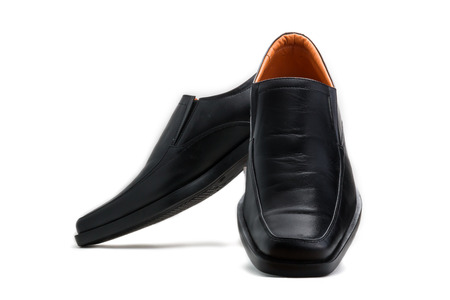 Black glossy man shoe isolated on white backgroundの写真素材