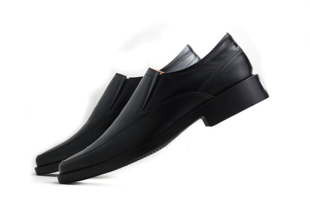 Black glossy man shoe isolated on white backgroundの写真素材