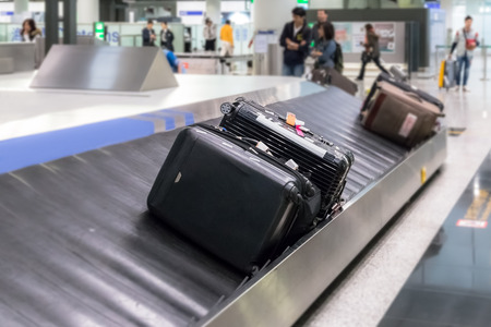Luggage on the track blur background and selective object in airportの写真素材